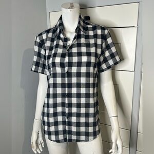 Collared. Full button up. Plaid shirt. Black and white. Short sleeve.